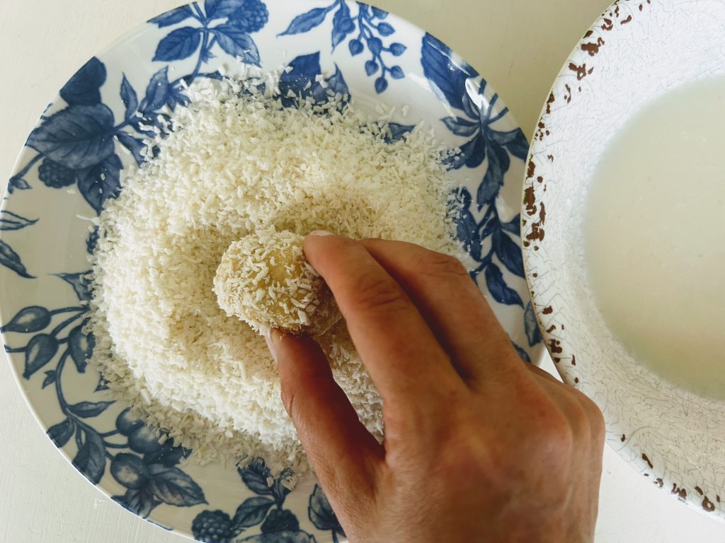 coating sourdough balls with coconut flakes